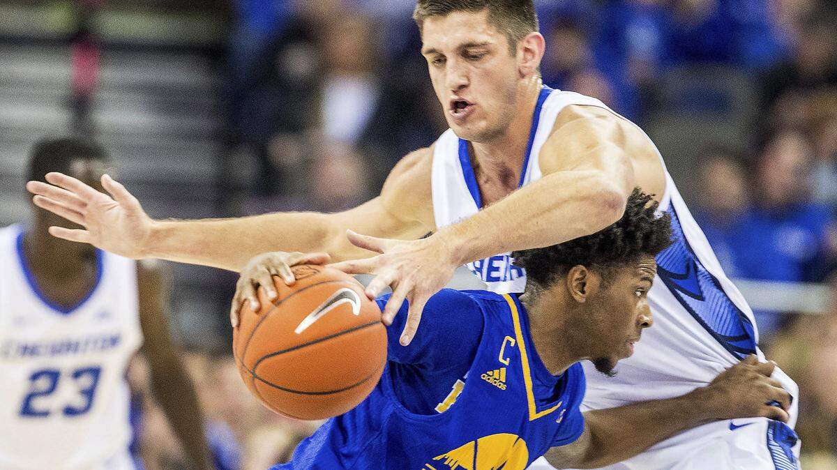 Creighton’s Martin Krampelj knocks the ball loose from UMKC’s Xavier Bishop during an NCAA college basketball game Thursday, Dec. 27, 2018, in Omaha, Neb. (Chris Machian/Omaha World-Herald via AP)