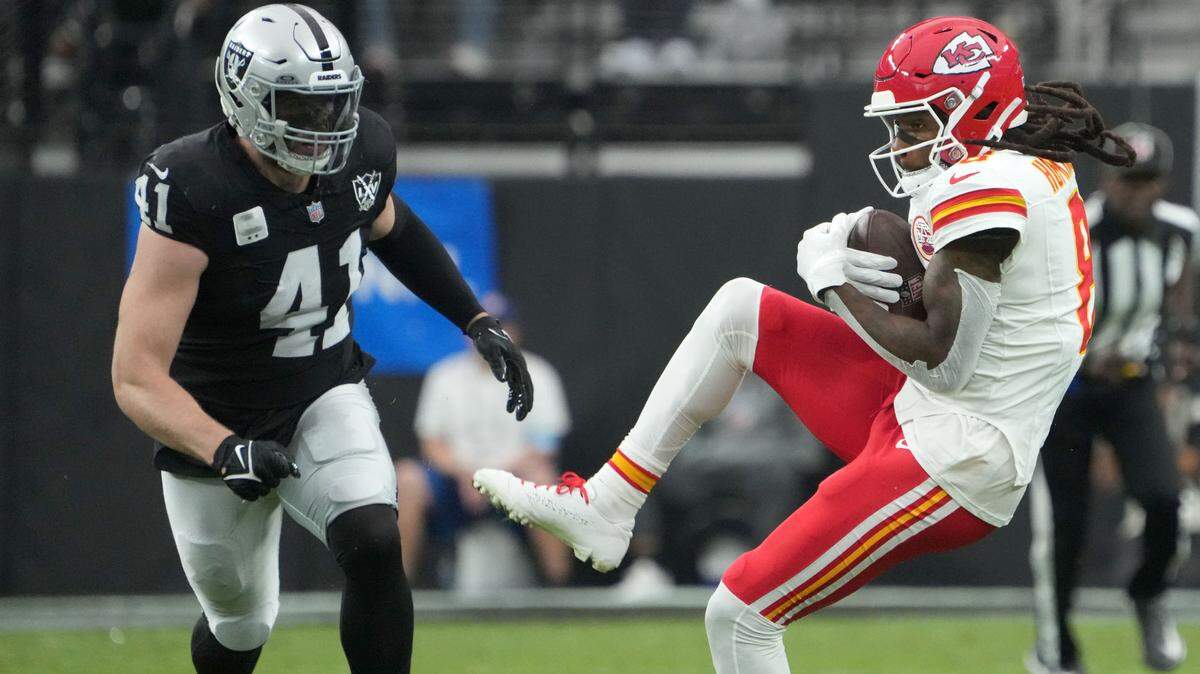 Kansas City Chiefs wide receiver DeAndre Hopkins (8) catches the ball against Las Vegas Raiders linebacker Robert Spillane (41) in the first half at Allegiant Stadium.