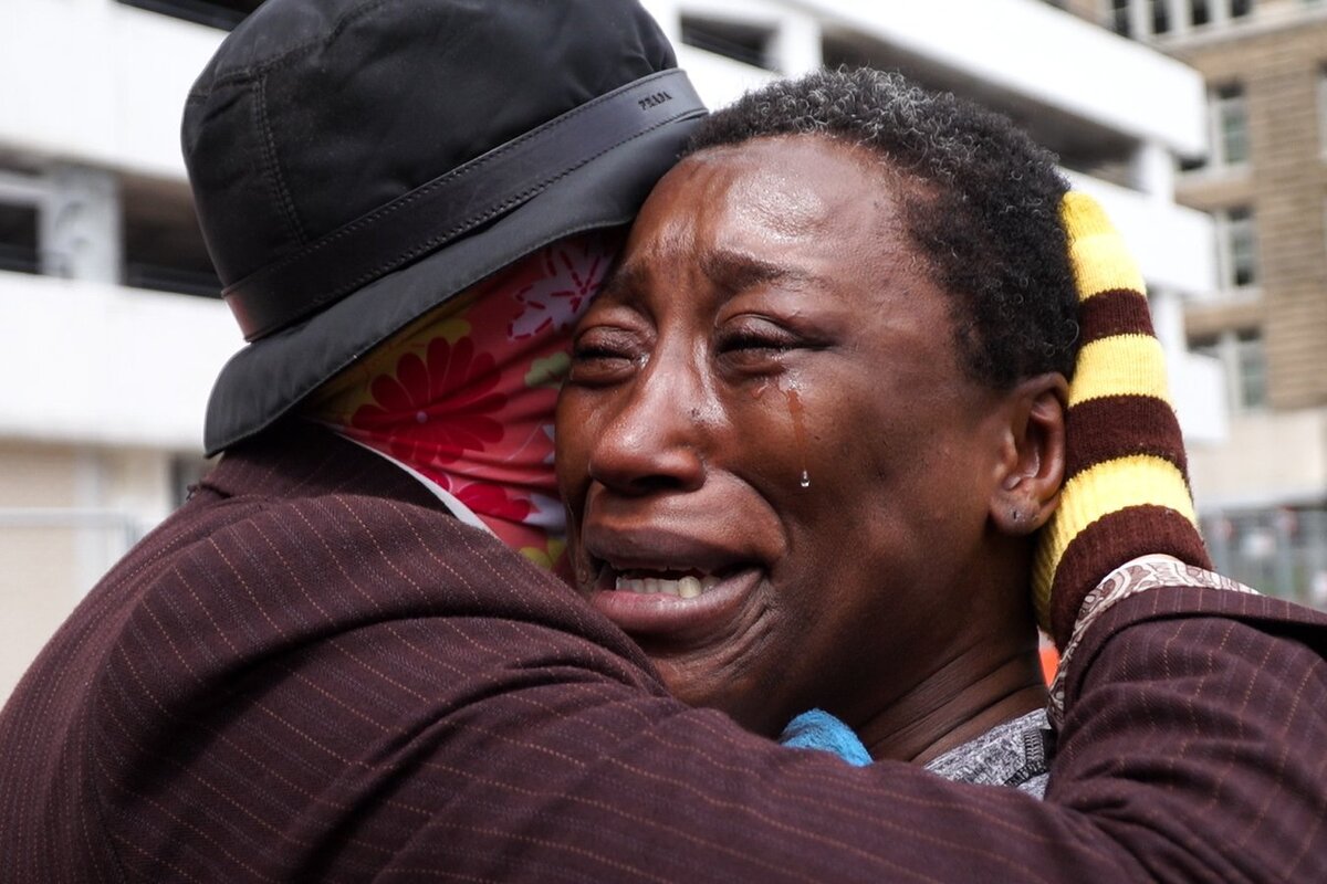 Angela Gatlin cries after Dr. MooMoo hands her a $100 bill.