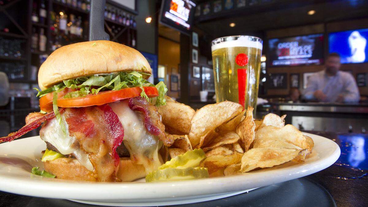 The OMG burger with chips and a pint of KC Bier Co. beer at Nick & Jake's, 6830 W. 135th St. in Overland Park.
