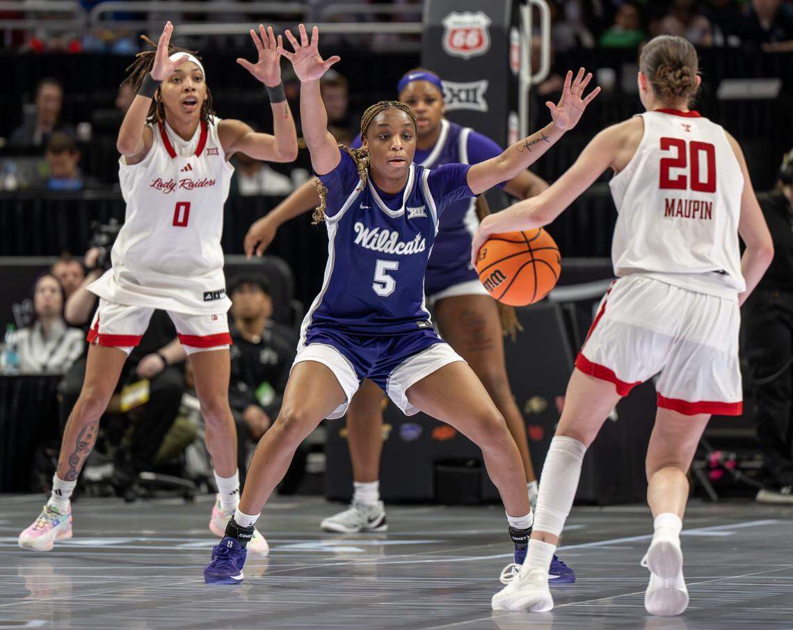 Kansas State Wildcats guard Aniya Foy (5) defends Texas Tech Red Raiders guard Bailey Maupin (20) during the second quarter of a Big 12 Women's Basketball Tournament game.