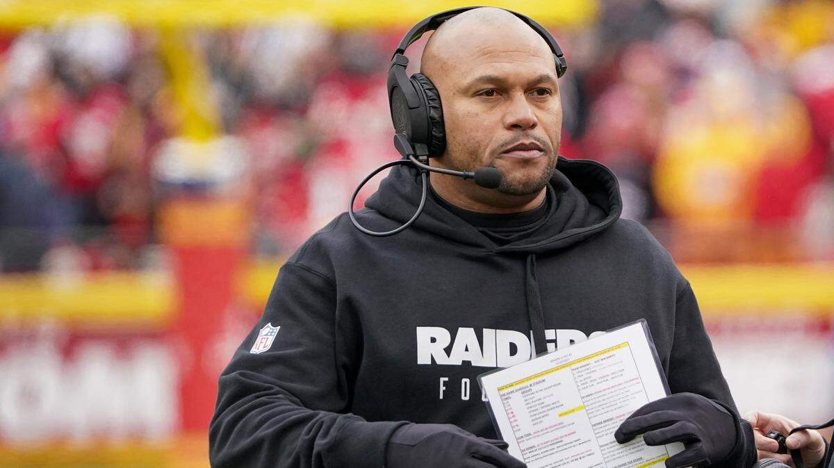 Las Vegas Raiders head coach Antonio Pierce on field against the Kansas City Chiefs during the first half at GEHA Field at Arrowhead Stadium.
