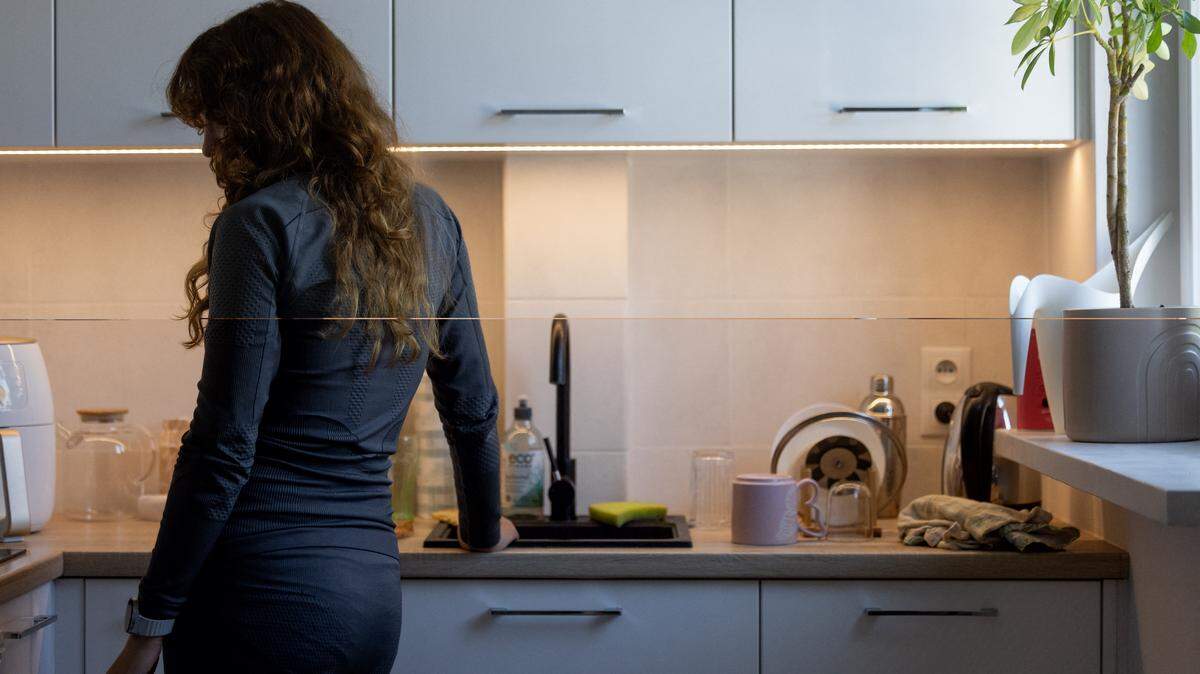 A woman stands in her kitchen. (Photo by Wojtek RADWANSKI / AFP) (Photo by WOJTEK RADWANSKI/AFP via Getty Images)