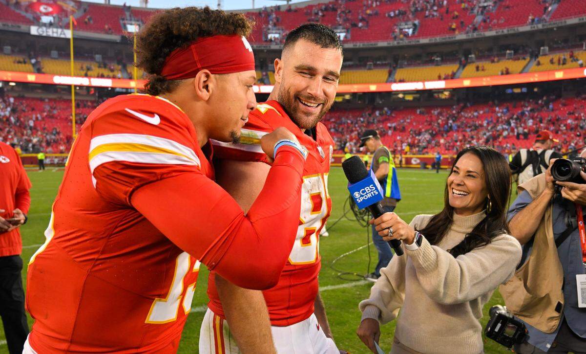 Kansas City Chiefs tight end Travis Kelce (87) laughs as quarterback Patrick Mahomes (15) interrupts a TV interview after defeating the Los Angeles Chargers 31-17 in an NFL football game at GEHA Field at Arrowhead Stadium on Monday, Oct. 23, 2023, in Kansas City.