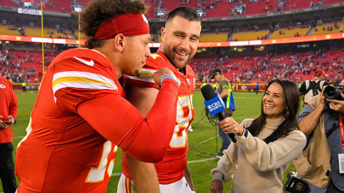 Kansas City Chiefs tight end Travis Kelce (87) laughs as quarterback Patrick Mahomes (15) interrupts a TV interview after defeating the Los Angeles Chargers 31-17 in an NFL football game at GEHA Field at Arrowhead Stadium on Monday, Oct. 23, 2023, in Kansas City.