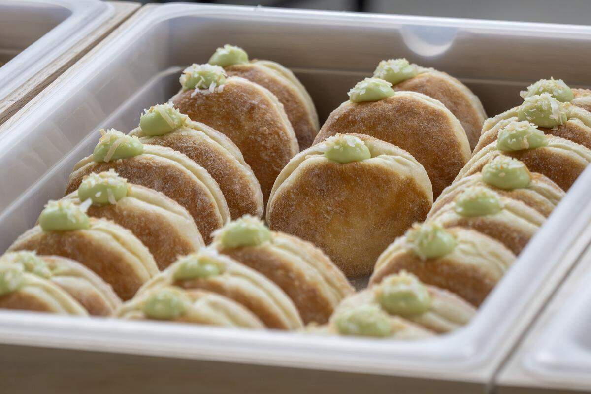 Pandan coconut flavored doughnuts are displayed behind glass at Slow Rise on Friday, Jan. 23, 2026, in Overland Park.
