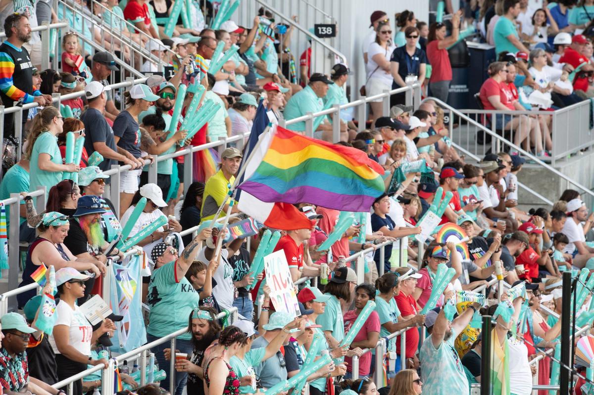 A KC Current fan waves a rainbow pride flag over seats on the east side of CPKC Stadium during a match on Friday, June 14, 2024.