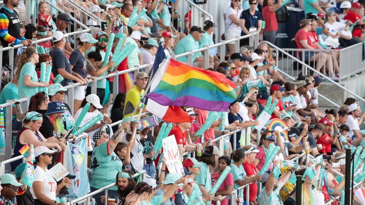 A KC Current fan waves a rainbow pride flag over seats on the east side of CPKC Stadium during a match on Friday, June 14, 2024.
