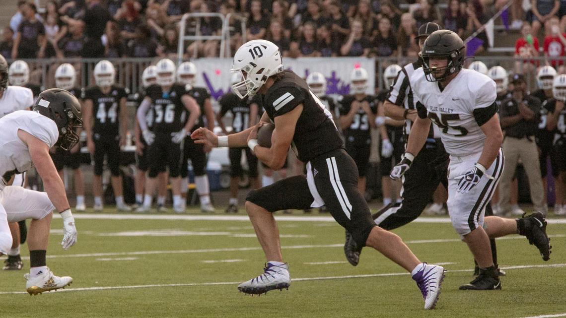 Blue Valley Northwest quarterback, #10, Mikey Pauley carried the ball during the game against Blue Valley, Friday, September 3, 2021 at Blue Valley Northwest. BVNW was ahead at the half 14-0.
