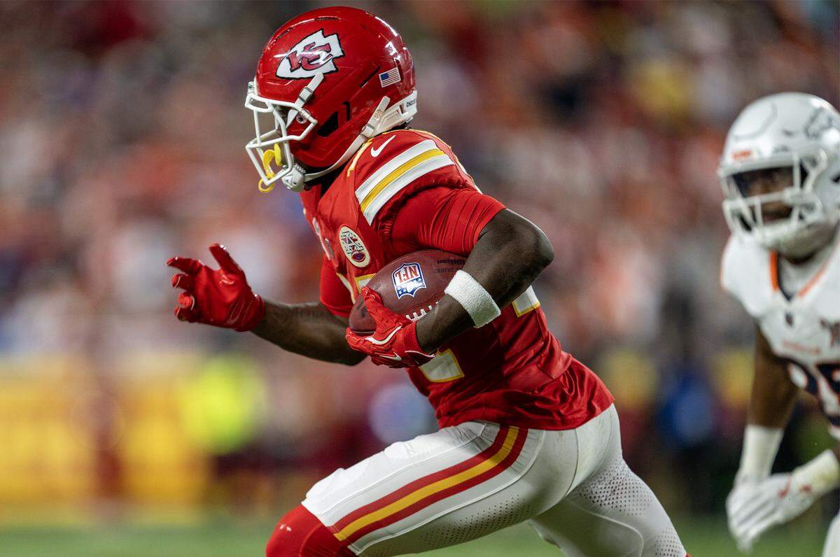 Kansas City Chiefs running back Brashard Smith (24) runs the ball back after a kick during the second half of the game against the Denver Broncos at GEHA Field at Arrowhead Stadium on Thursday, Dec. 25, 2025, in Kansas City. Denver defeated the Chiefs, 20-13.