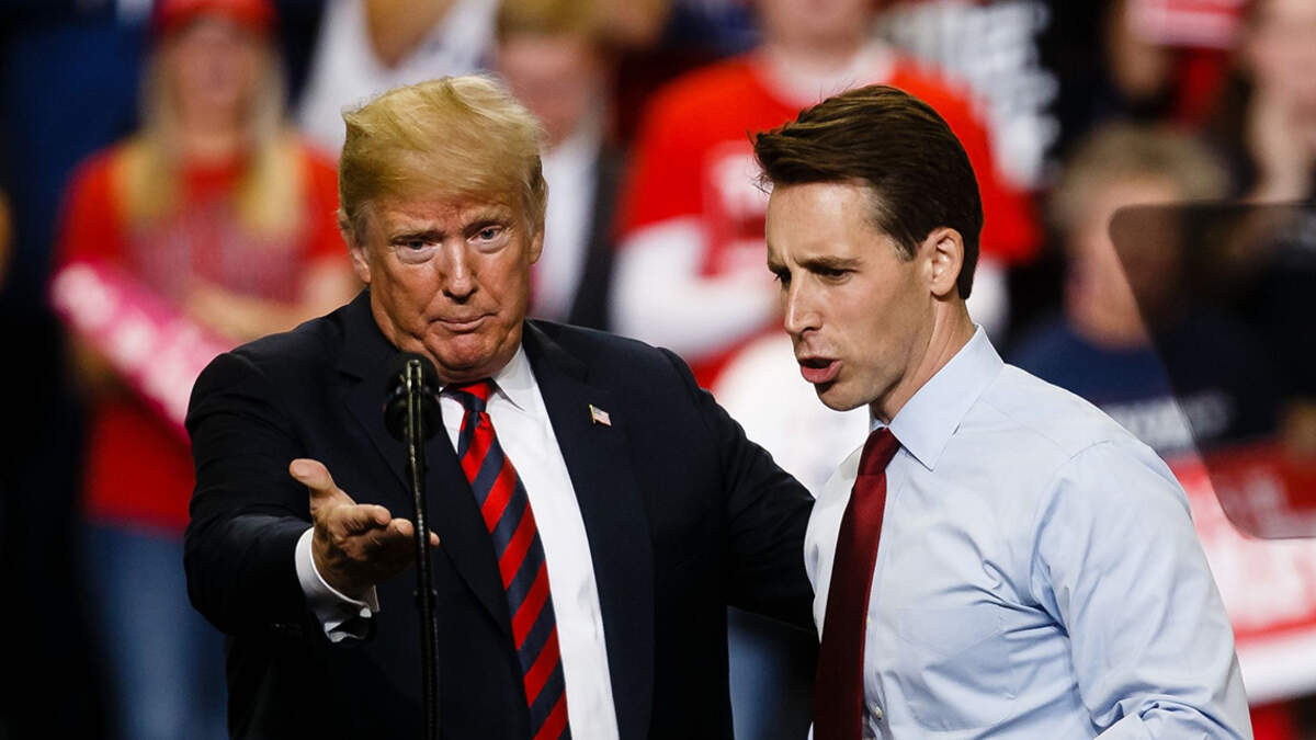 Senate candidate Josh Hawley greets President Donald Trump at the podium during a Make America Great Again rally at JQH Arena on the campus of Missouri State University on Friday, Sept. 21, 2018 in Springfield. 