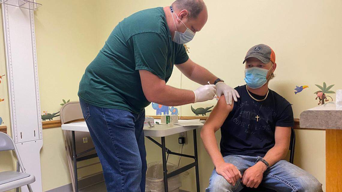 Ethan Weis, 20, of Chillicothe receives the second dose of his COVID-19 vaccine from a health care worker at the Livingston County Health Center on June 17, where cases have been unusually high. The latest CDC ranking of COVID variants says Missouri has the highest percentage of delta cases.