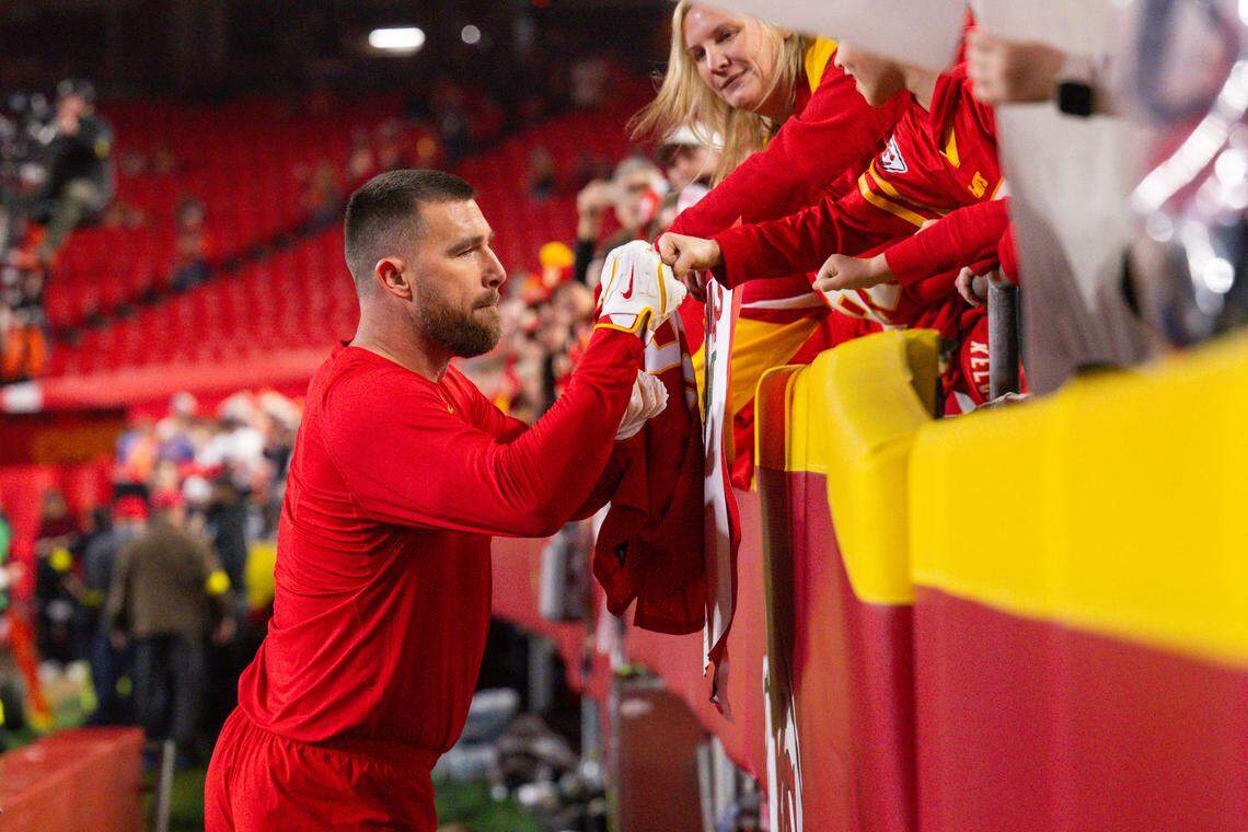 Kansas City Chiefs tight end Travis Kelce (87) fist bumps fans after warmups prior to the Chiefs game vs. the Denver Broncos on Thursday, December 25, 2025, at GEHA Field at Arrowhead Stadium.