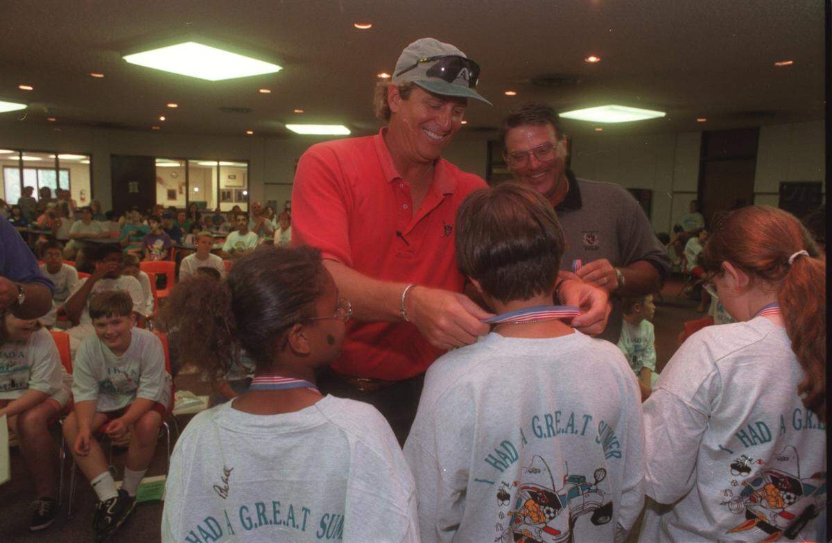 Former Kansas City Royals players Pete LaCock (left) and Darrell Porter (right) signing autographs in 1998 at a summer camp program in Leavenworth.