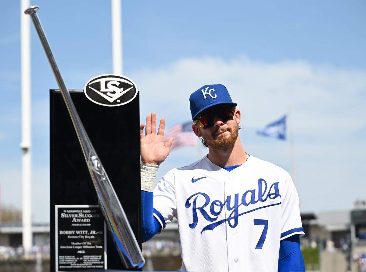 Kansas City Royals shortstop Bobby Witt Jr. (7) is awarded the Silver Slugger before the home opener against the Minnesota Twins on Monday, March 30, 2026, in Kansas City.