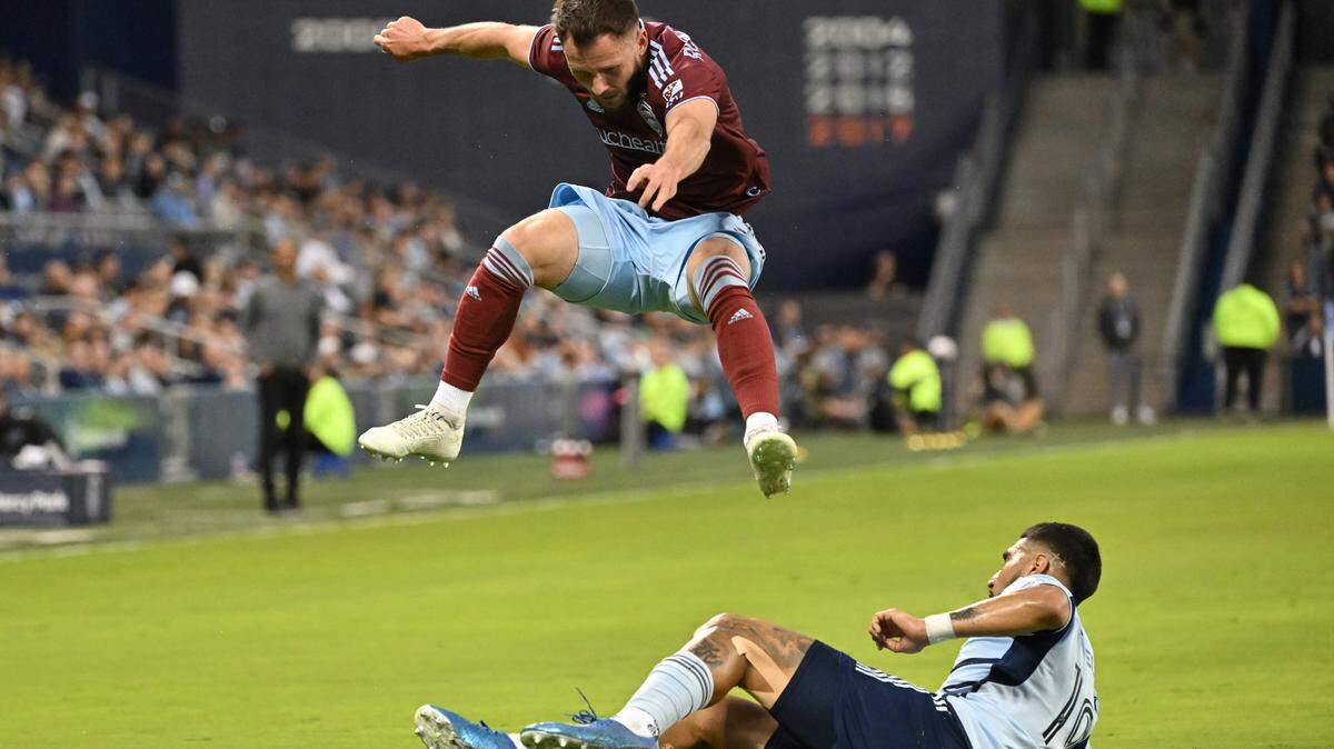 Colorado Rapids defender Keegan Rosenberry flies over Sporting Kansas City defender Robert Castellanos during Saturday night’s MLS match at Children’s Mercy Park in Kansas City, Kan.