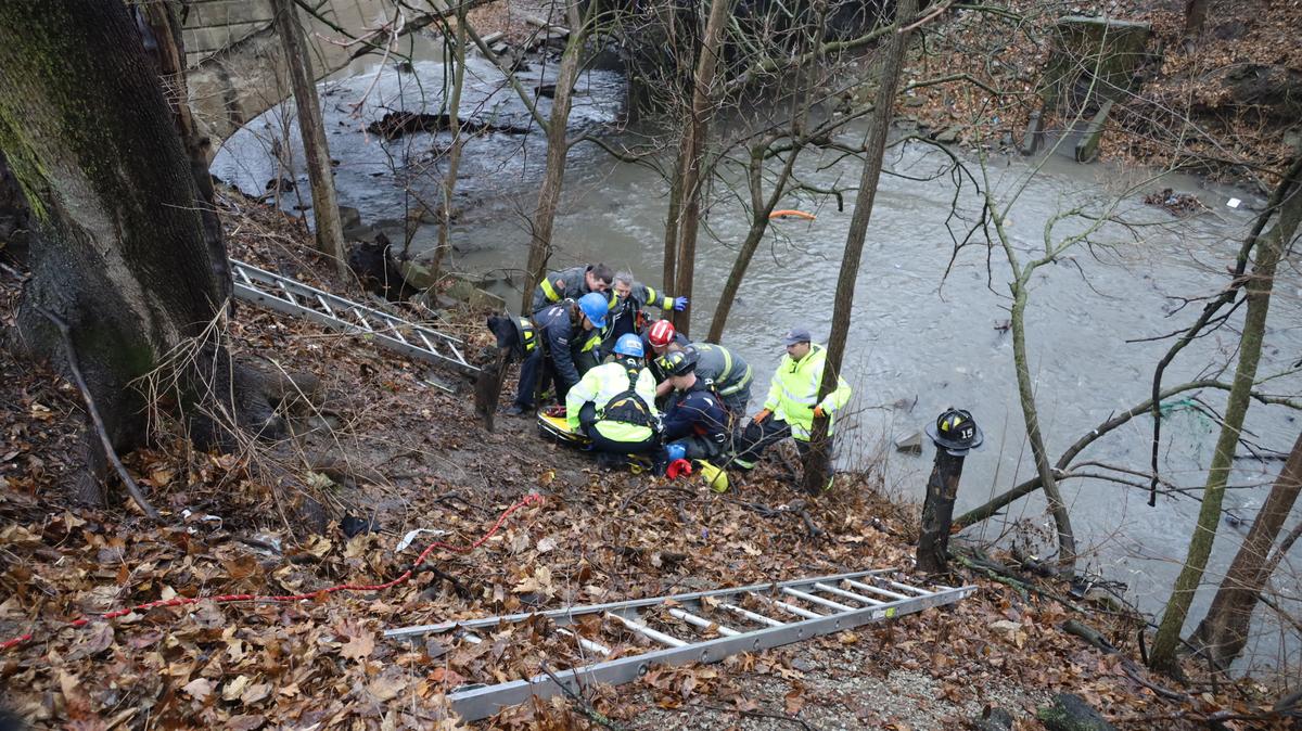 Firefighters rescue a 60-year-old woman who was stuck in an embankment.