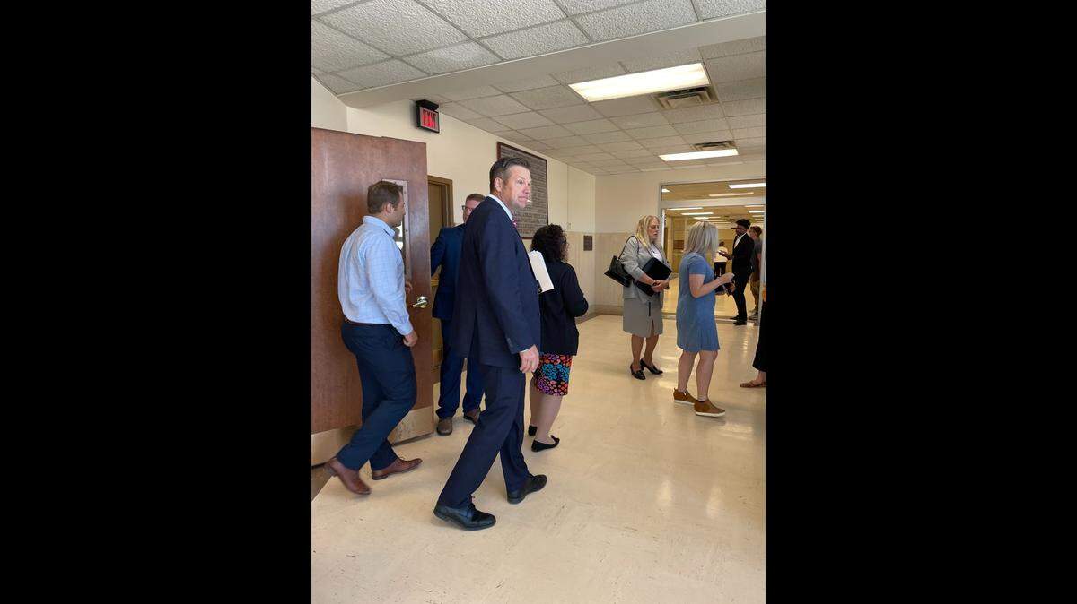 Kansas Attorney General Kris Kobach exits a courtroom on August 16, 2023, after a hearing about changing gender markers on driver’s licenses.