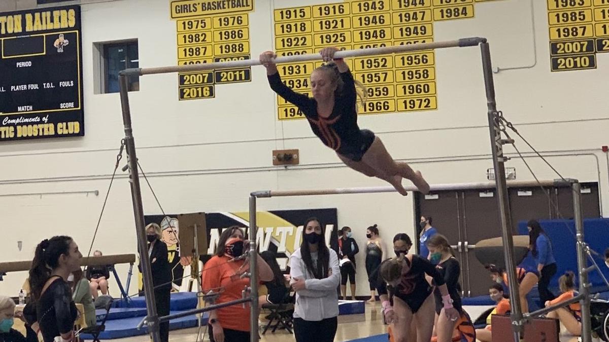 Kadence Peel of Shawnee Mission Northwest competes on the uneven bars during Saturday’s Kansas high school state gymnastics meet in Newton.