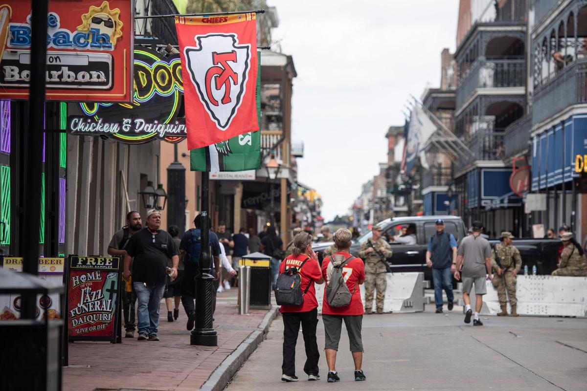 Chiefs fans walks along Bourbon Street in New Orleans on Wednesday, Feb. 5, 2025.