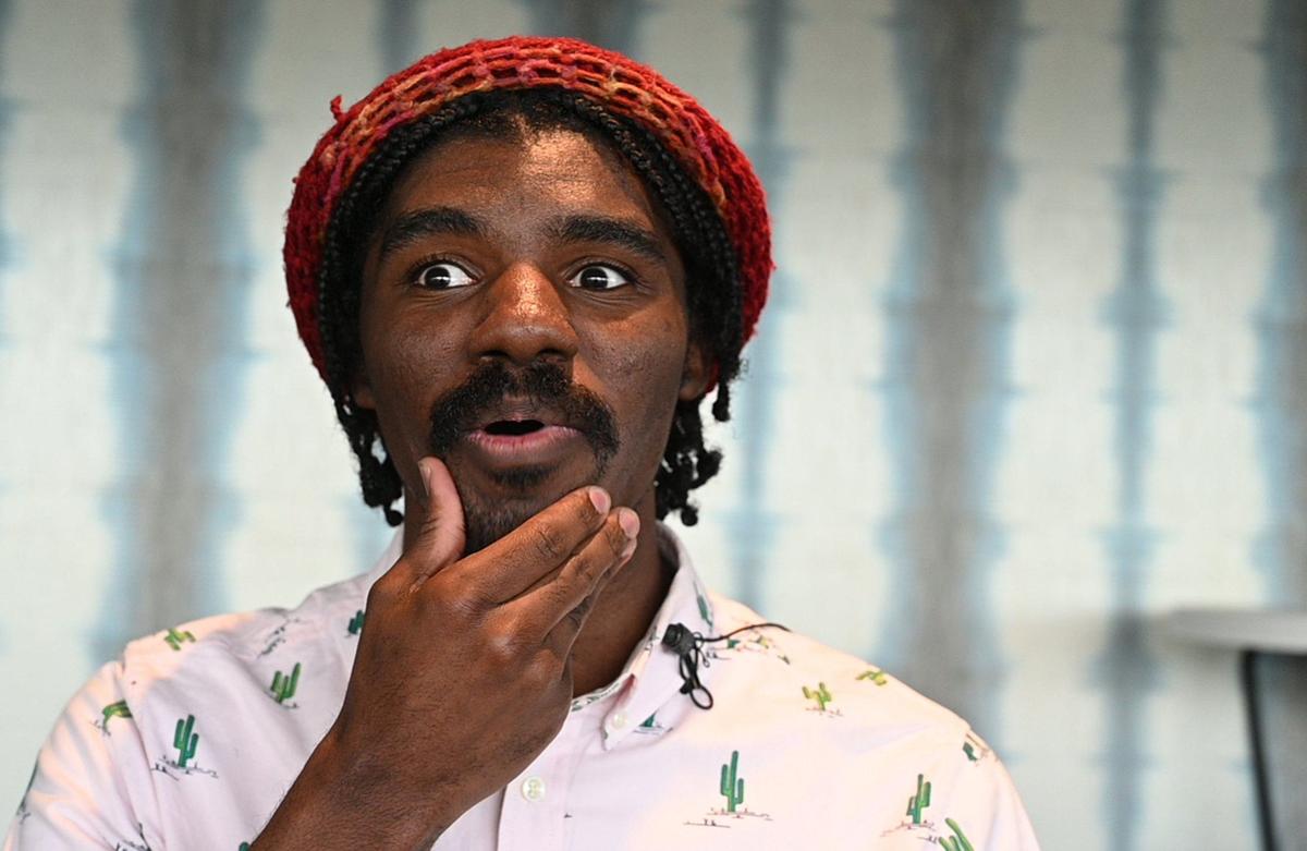 Zachery Garner, a puppeteer, talks about operating the Audrey II, the giant puppet of a man-eating plant, before the final dress rehearsal for the KC Rep’s production of the “Little Shop of Horrors.”