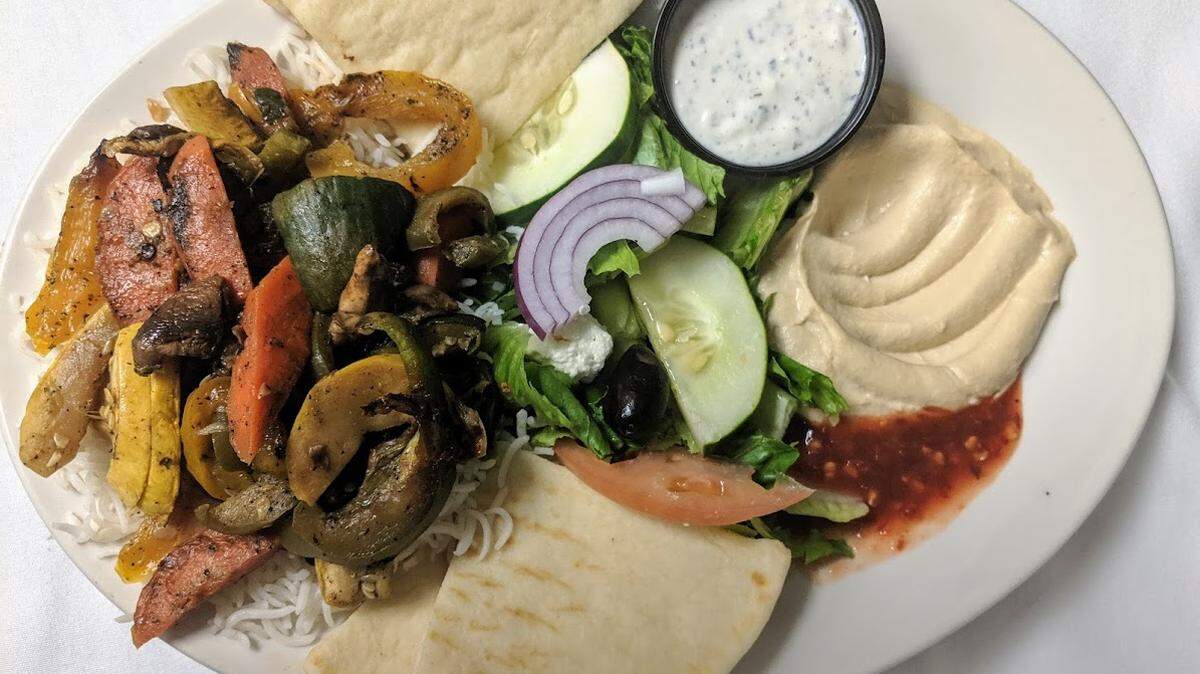 Zaina’s grilled vegetables plate with hummus, Greek salad, basmati rice and pita.