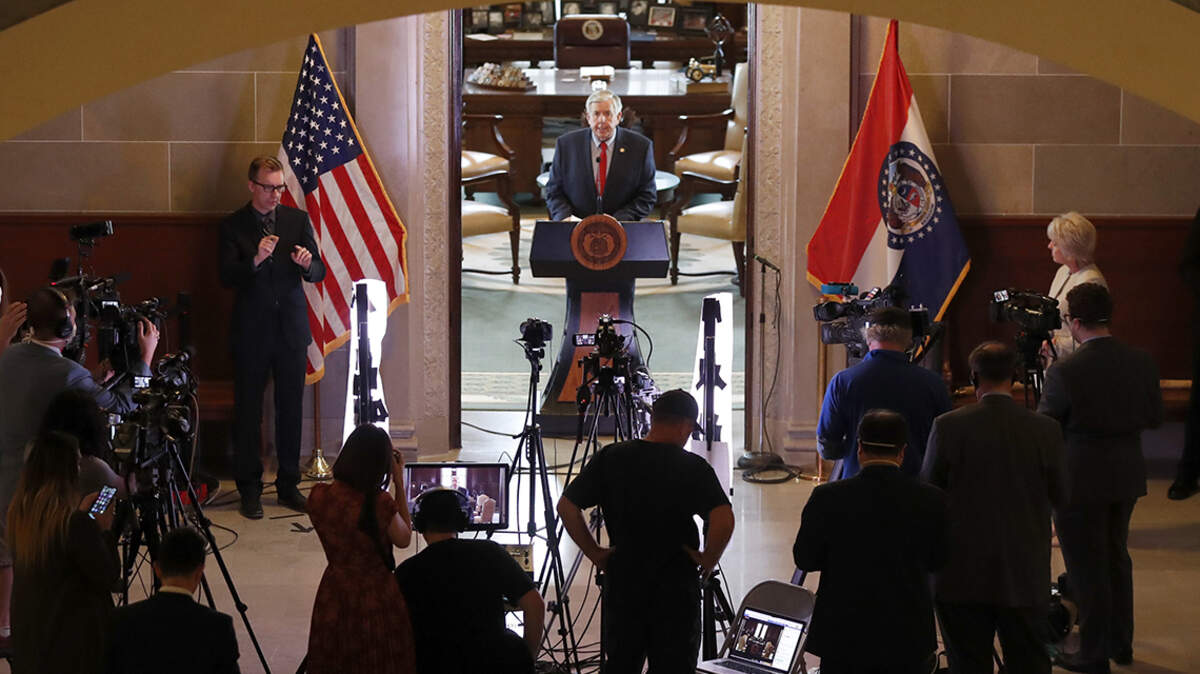 Missouri Gov. Mike Parson conducts his daily coronavirus briefing from the doorway of his office inside the state Capitol Monday, April 27, 2020, in Jefferson City, Mo. Parson announced he will lift some restrictions put in place to slow the spread of COVID-19 and allow the reopening of some businesses and other activities starting on May 4.