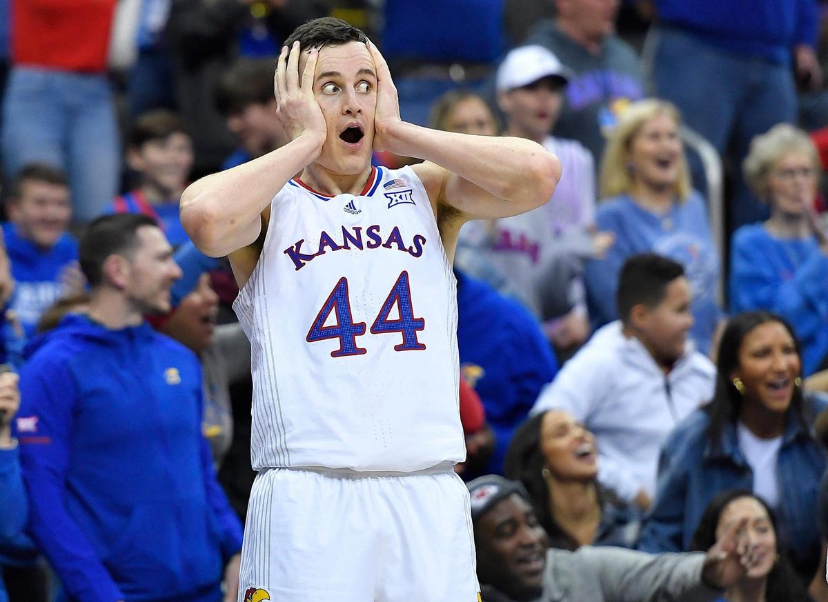 KU’s Mitch Lightfoot reacts to the alley-oop dunk by teammate Ochai Agbaji during the second half of Friday’s semifinal game at the Big 12 Tournament in Kansas City. KU beat TCU, 75-62.