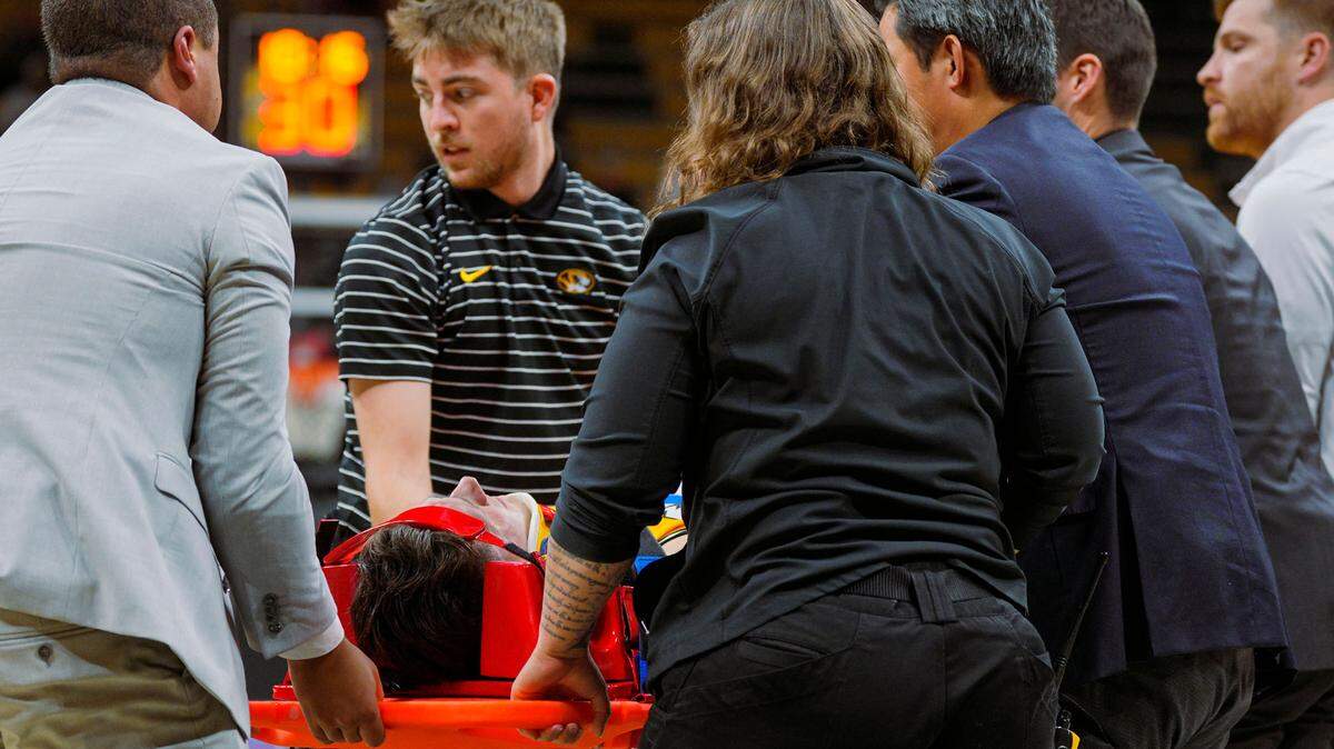 Missouri Tigers guard Caleb Grill (31) is stretchered off the court after an injury during the first half against the Lindenwood Lions at Mizzou Arena on Nov. 27, 2024.