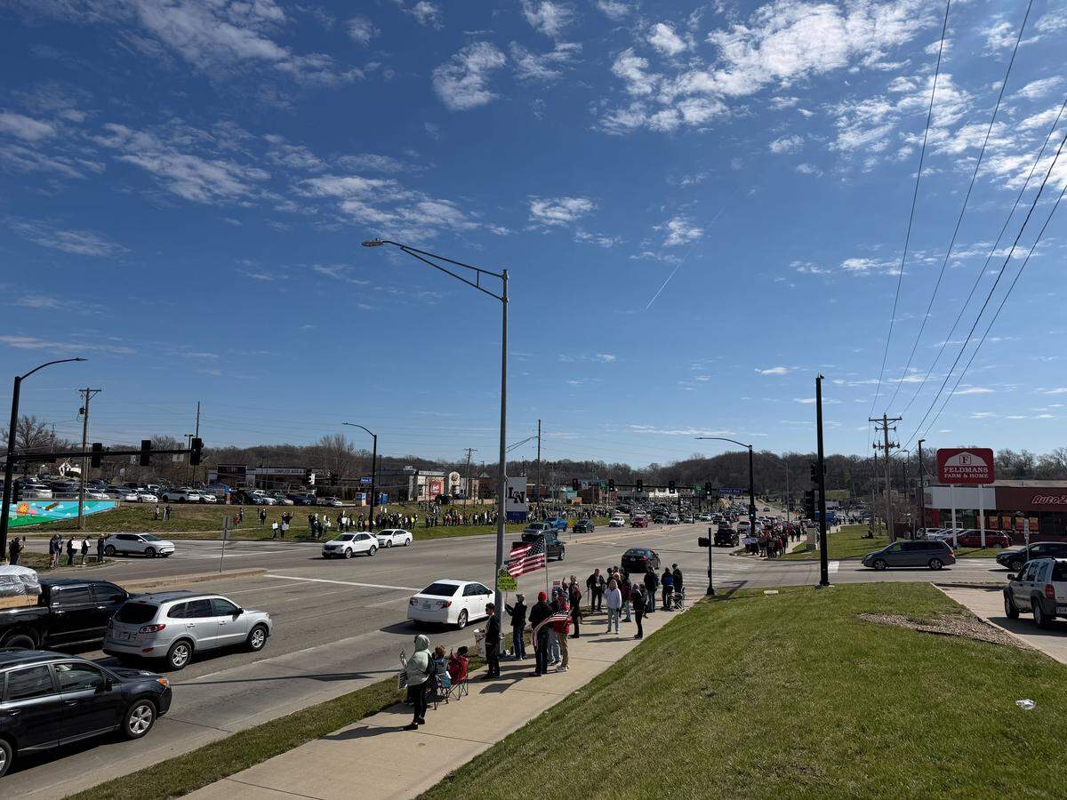 Cars go by protesters in Liberty during No Kings rallies around the country on Saturday, March 28.