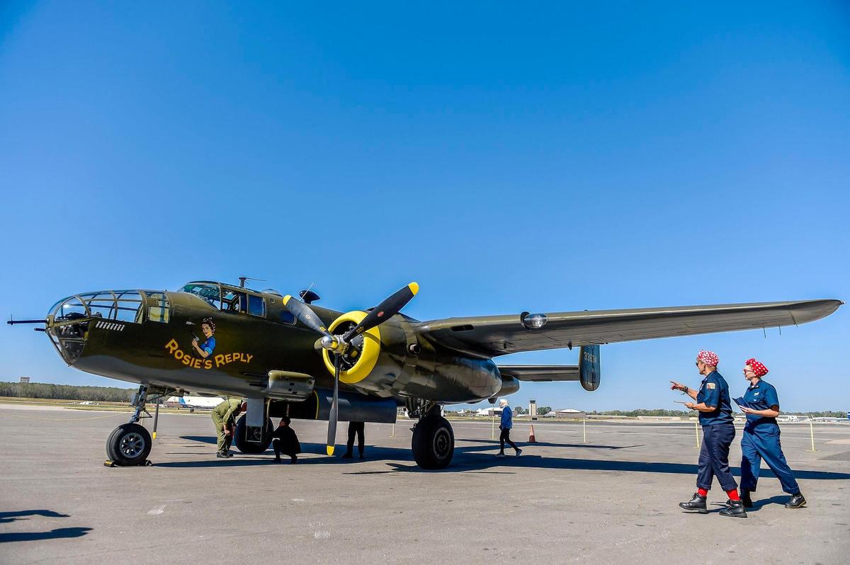 Rosie’s Reply, a B-25D bomber built at the North American Aviation plant in Fairfax, arrived at Charles B. Wheeler Downtown Airport Monday, Oct. 4, 2021, the first time it has been back to Kansas City, Kansas, since it flew out for World War II. Debra Carver, left, and Wendy Albers are Tribute Rosie the Riverters, volunteers with the Yankee Air Museum in Belleville, Michigan, which owns and maintains the plane. Rosie’s Replay is scheduled to fly over the Fairfax Festival Oct. 7. Rosie’s Replay is scheduled to fly over the Fairfax Festival Oct. 7.