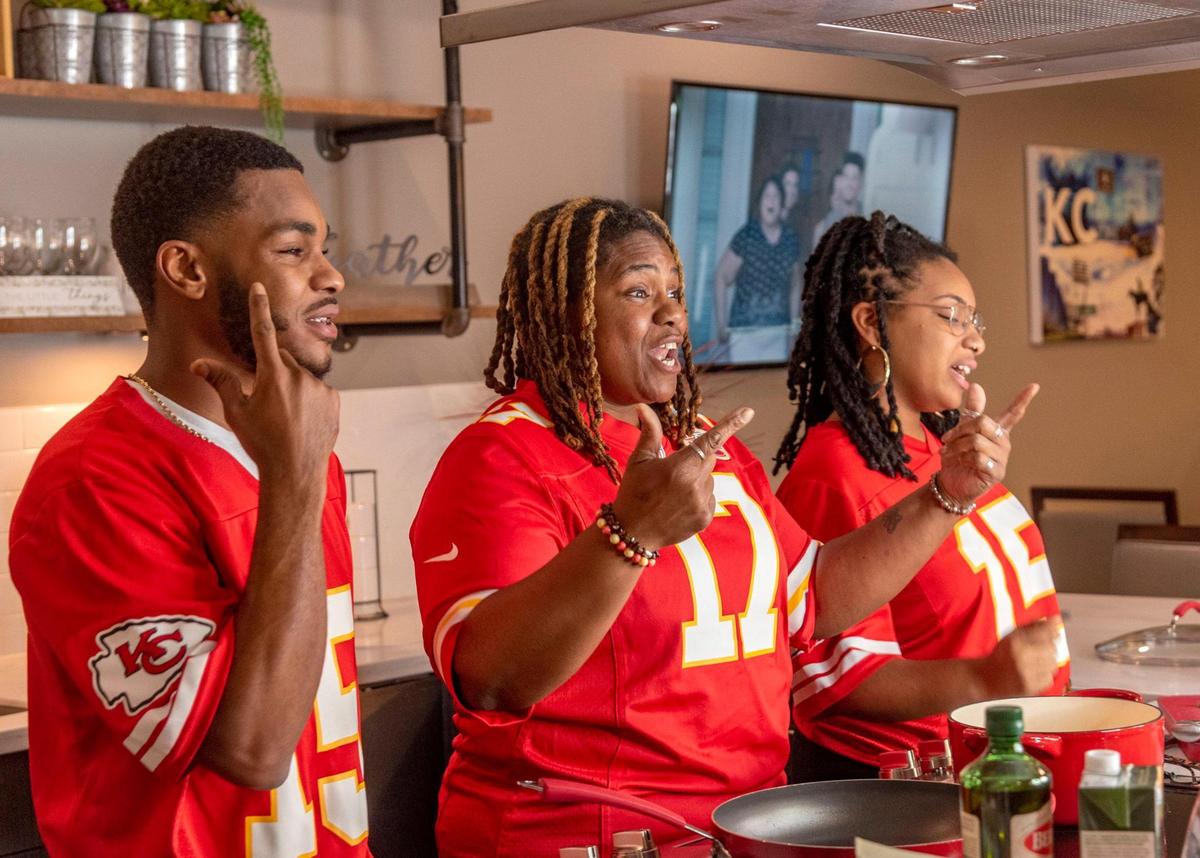 A family sing-along was part of the “KC Girl on the Move” live cooking show. Stacey Hardman, center, and her kids Todd and Raven Ashley helped with commentary and cooking.