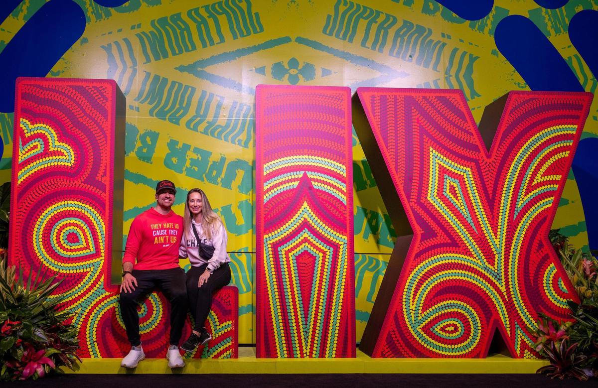 Billy and Ashley Yeo of Overland Park sat to have their photo taken with an over-sized Super Bowl LIX logo during a visit to the Super Bowl Experience at the Ernest N. Morial Convention Center on Thursday, Feb. 6, 2025, in New Orleans.