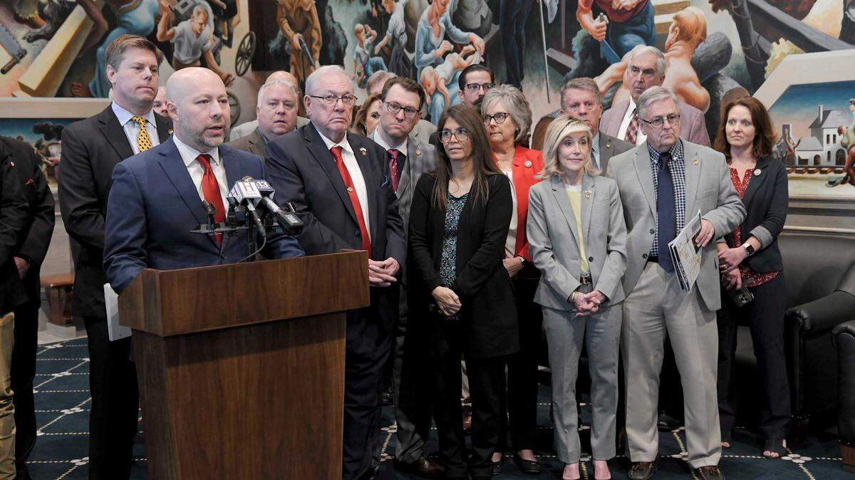 Rep. Cody Smith, a Carthage Republican, stands at a podium to speak with reporters on March 14 about the Missouri House’s proposed budget for the next fiscal year.
