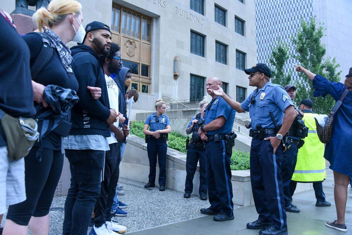 Protesters and Kansas City police faced off during a protest outside Kansas City Police Department headquarters on June 27.