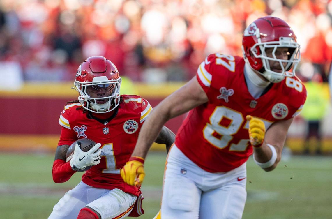 Kansas City Chiefs wide receiver Xavier Worthy (1) runs for a first down behind tight end Travis Kelce (87) in the second half against the Houston Texans at GEHA Field at Arrowhead Stadium on Saturday, Dec. 21, 2024.