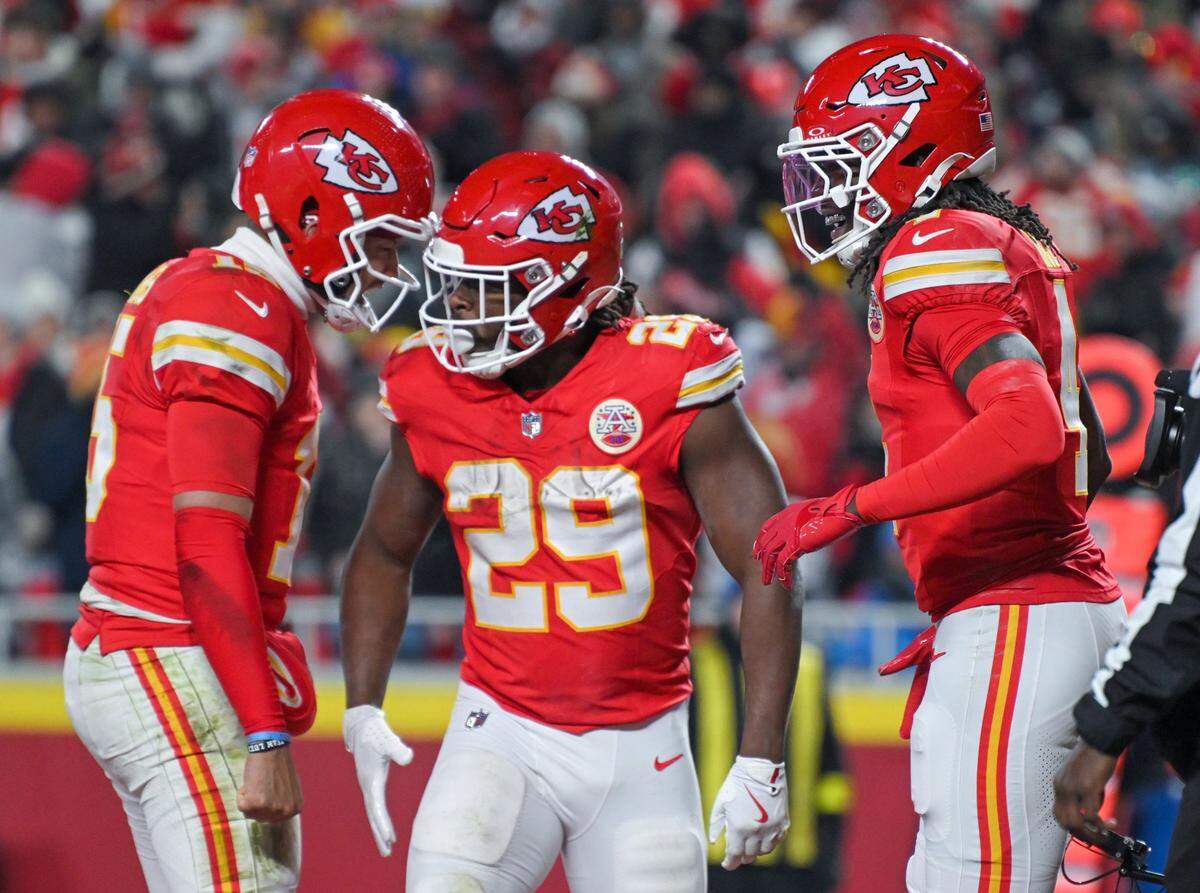Chiefs quarterback Patrick Mahomes (15), running back Kareem Hunt (29) and wide receiver Rashee Rice (4) celebrate a touchdown in the third quarter of the game against the Houston Texans at GEHA Field at Arrowhead Stadium on Sunday, Dec. 7, 2025.