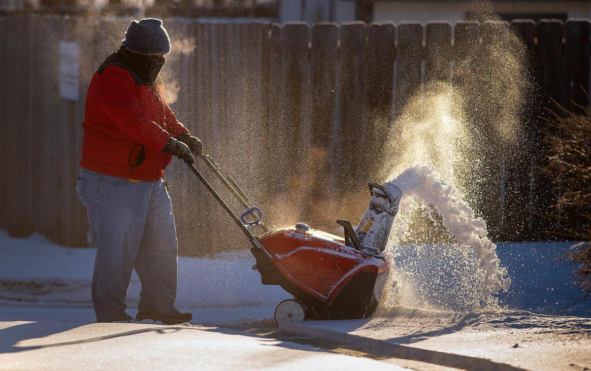 Using a snow blower, Edson Palacios braved the sub-zero temperatures to clear the sidewalks Tuesday, Feb. 16, at Colonial Church in Prairie Village.