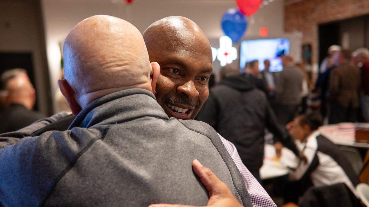 Democratic Party candidate for Johnson County Sheriff Byron Roberson gets a hug from a supporter at an election night watch party on Tuesday, Nov. 5, 2024, in downtown Overland Park.