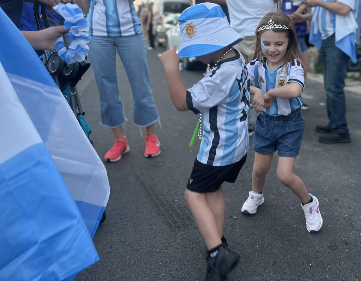After the street closed for the event, local Emilio Oliveira danced with Leandra Bisson from Argentina. Despite not knowing each other, the two danced and played together during the celebration.