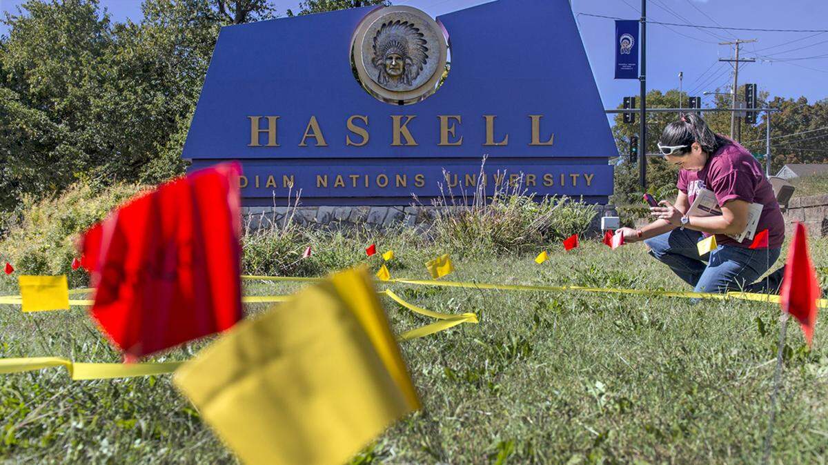 Kahheetah Barnoskie placed a flag with the name of her tribe, Pawnee, during a celebration on Monday, Oct. 12, 2015, at Haskell Indian Nations University in Lawrence to celebrate Indigenous Peoples’ Day. 