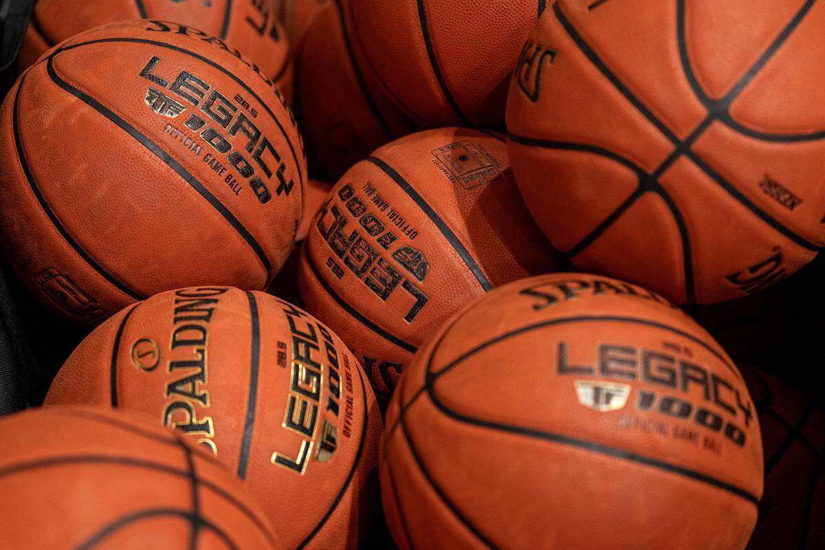 Basketballs sit in a cart at Park Hill South High School on Wednesday, Jan. 21, 2026, in Riverside.
