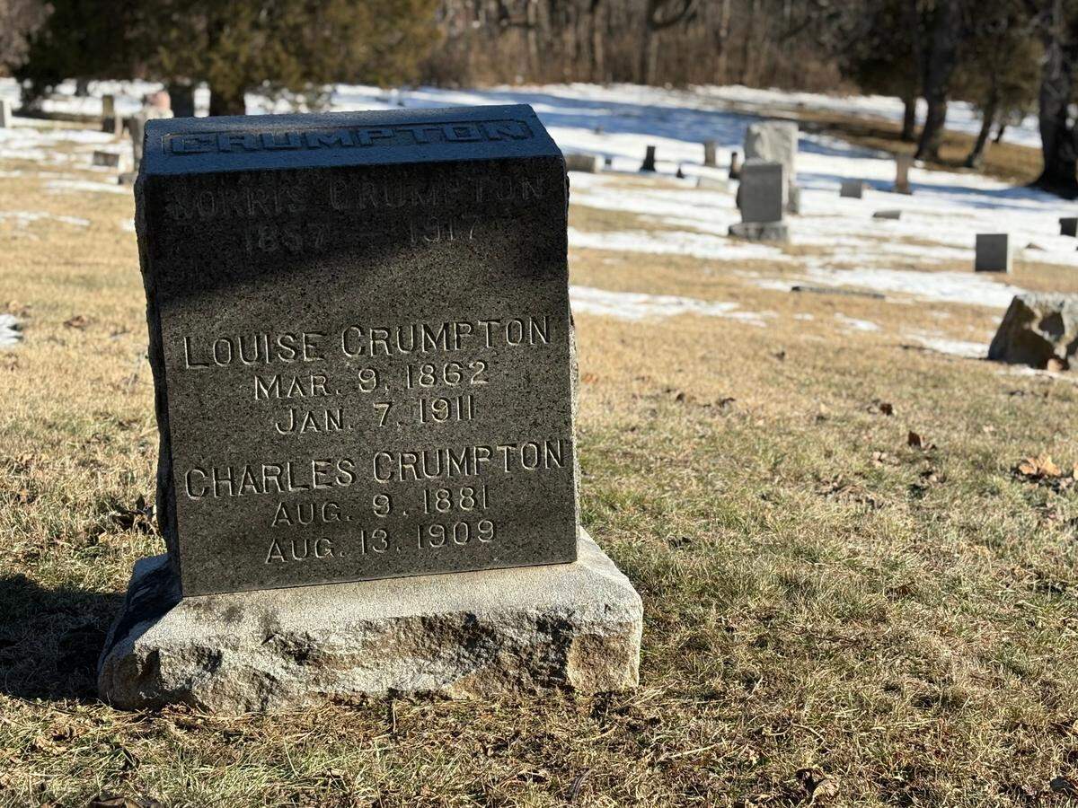 The snow has melted off the headstone for Louise and Charles Crumpton in Highland Cemetery in Blue Summit, just east of Kansas City, on Thursday, Jan. 23.