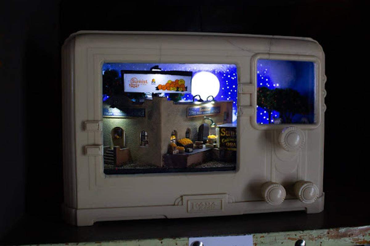 One of Scott Hildenbrandt’s dioramas shows a scene inside an old radio.