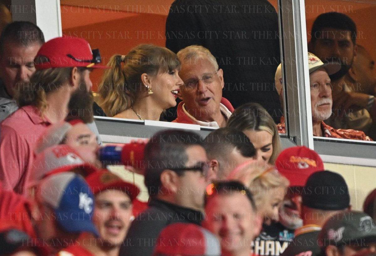Pop superstar Taylor Swift, talks with her father, Scott Swift, at a Kansas City Chiefs game at GEHA Field at Arrowhead Stadium on Oct. 7, 2024.