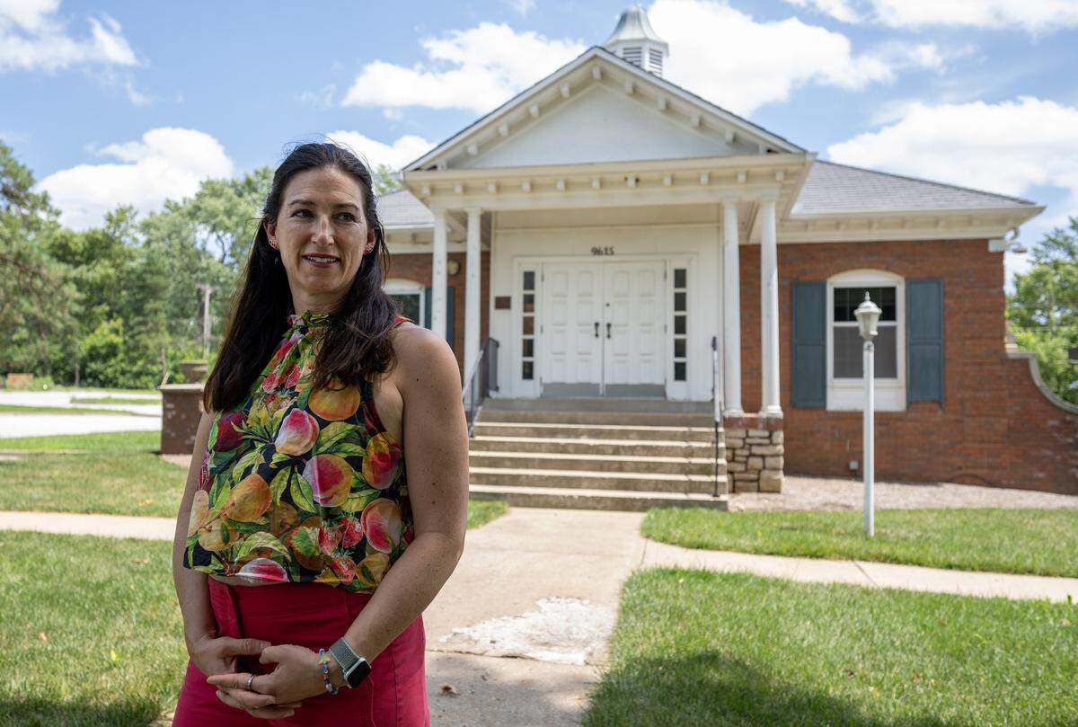 Jaclyn Penn stands for a portrait outside the old Leawood City Hall building on Wednesday, July 23, 2025, in Leawood, Kan. Penn is among a group of residents pushing to convert the vacant structure into a community center.