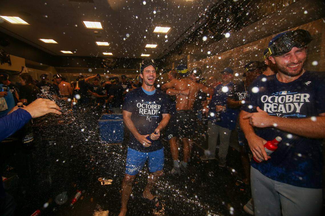 Kansas City Royals second baseman Adam Frazier (26) celebrates after clinching a wild card playoff birth after a game against the Atlanta Braves at Truist Park.