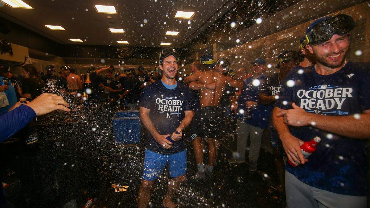 Kansas City Royals second baseman Adam Frazier (26) celebrates after clinching a wild card playoff berth after a game against the Atlanta Braves at Truist Park.