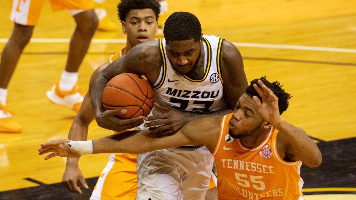 Missouri’s Jeremiah Tilmon, center, pulls down a rebound between Tennessee’s E.J. Anosike, right, and Jaden Springer during the second half of an NCAA college basketball game Wednesday, Dec. 30, 2020, in Columbia, Mo. (AP Photo/L.G. Patterson)