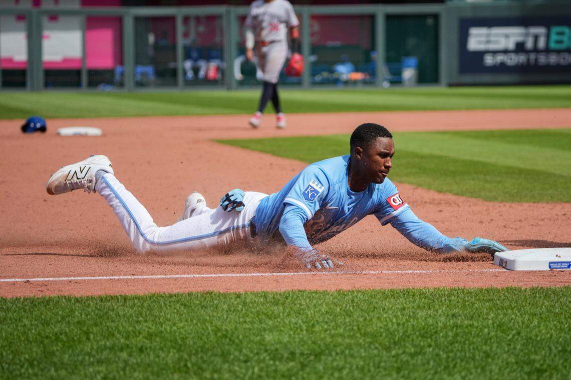Kansas City Royals shortstop Tyler Tolbert (2) slides into third base against the Minnesota Twins in the eighth inning at Kauffman Stadium on April 10, 2025 in Kansas City.